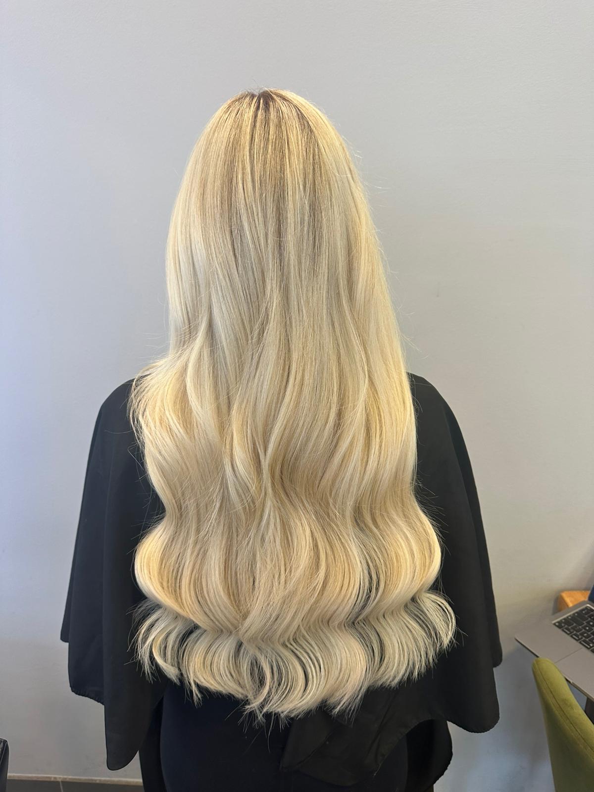 Platinum blonde hair extensions by QOGH